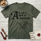 Ask and It Shall Be Fetched Chihuahua T-Shirt flat lay in Heather Military Green, featuring a sparse pen-and-ink illustration of a Chihuahua at a proud trot carrying an oversized fig leaf.