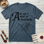 Ask and It Shall Be Fetched Chihuahua T-Shirt flat lay in Indigo Blue, featuring a sparse pen-and-ink illustration of a Chihuahua at a proud trot carrying an oversized fig leaf.