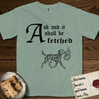 Ask and It Shall Be Fetched Dalmatian T-Shirt flat lay in Bay, featuring a sparse pen-and-ink illustration of a Dalmatian at a proud trot carrying a small burning bush.