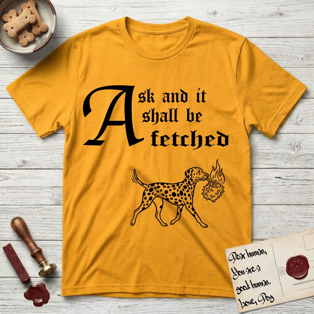 Ask and It Shall Be Fetched Dalmatian T-Shirt flat lay in Gold, featuring a sparse pen-and-ink illustration of a Dalmatian at a proud trot carrying a small burning bush.