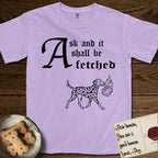 Ask and It Shall Be Fetched Dalmatian T-Shirt flat lay in Orchid, featuring a sparse pen-and-ink illustration of a Dalmatian at a proud trot carrying a small burning bush.