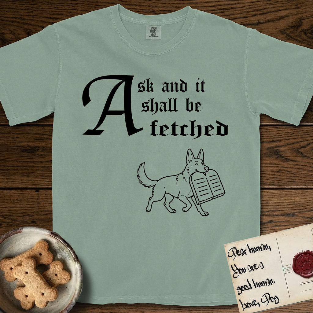 Ask and It Shall Be Fetched German Shepherd T-Shirt flat lay in Bay, featuring a sparse pen-and-ink illustration of a German Shepherd at a proud trot carrying a pair of stone tablets.
