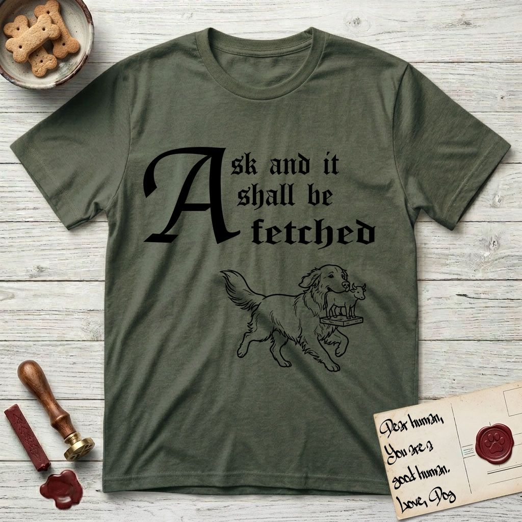 Ask and It Shall Be Fetched Golden Retriever T-Shirt flat lay in Heather Military Green, featuring a sparse pen-and-ink illustration of a Golden Retriever at a proud trot carrying a golden calf idol on a plinth.