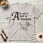 Ask and It Shall Be Fetched Lobo T-Shirt flat lay in Ice Grey, featuring a sparse pen-and-ink illustration of Lobo, a black-and-white Australian Cattle Dog and Pitbull mix, at a proud trot carrying a chalice.