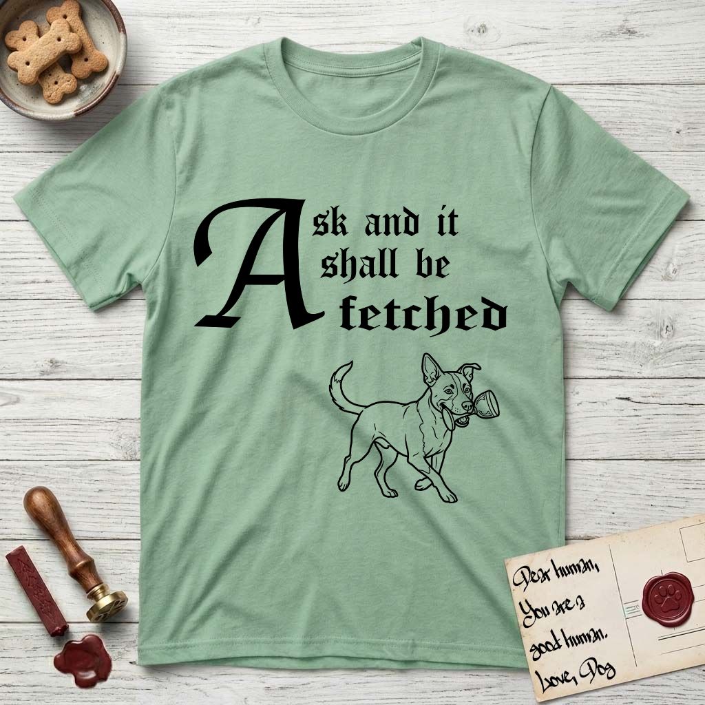 Ask and It Shall Be Fetched Lobo T-Shirt flat lay in Mint Green, featuring a sparse pen-and-ink illustration of Lobo, a black-and-white Australian Cattle Dog and Pitbull mix, at a proud trot carrying a chalice.