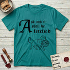 Ask and It Shall Be Fetched Newfoundland T-Shirt flat lay in Jade Dome, featuring a sparse pen-and-ink illustration of a Newfoundland at a proud trot carrying loaves and fishes.