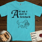 Ask and It Shall Be Fetched Newfoundland T-Shirt flat lay in Lagoon Blue, featuring a sparse pen-and-ink illustration of a Newfoundland at a proud trot carrying loaves and fishes.
