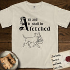 Ask and It Shall Be Fetched Pitbull T-Shirt flat lay in Ivory, featuring a sparse pen-and-ink illustration of a Pitbull at a proud trot carrying a baby in a reed basket.