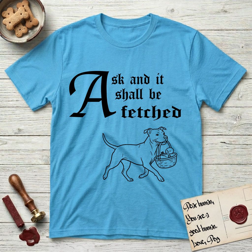 Ask and It Shall Be Fetched Pitbull T-Shirt flat lay in Sky, featuring a sparse pen-and-ink illustration of a Pitbull at a proud trot carrying a baby in a reed basket.