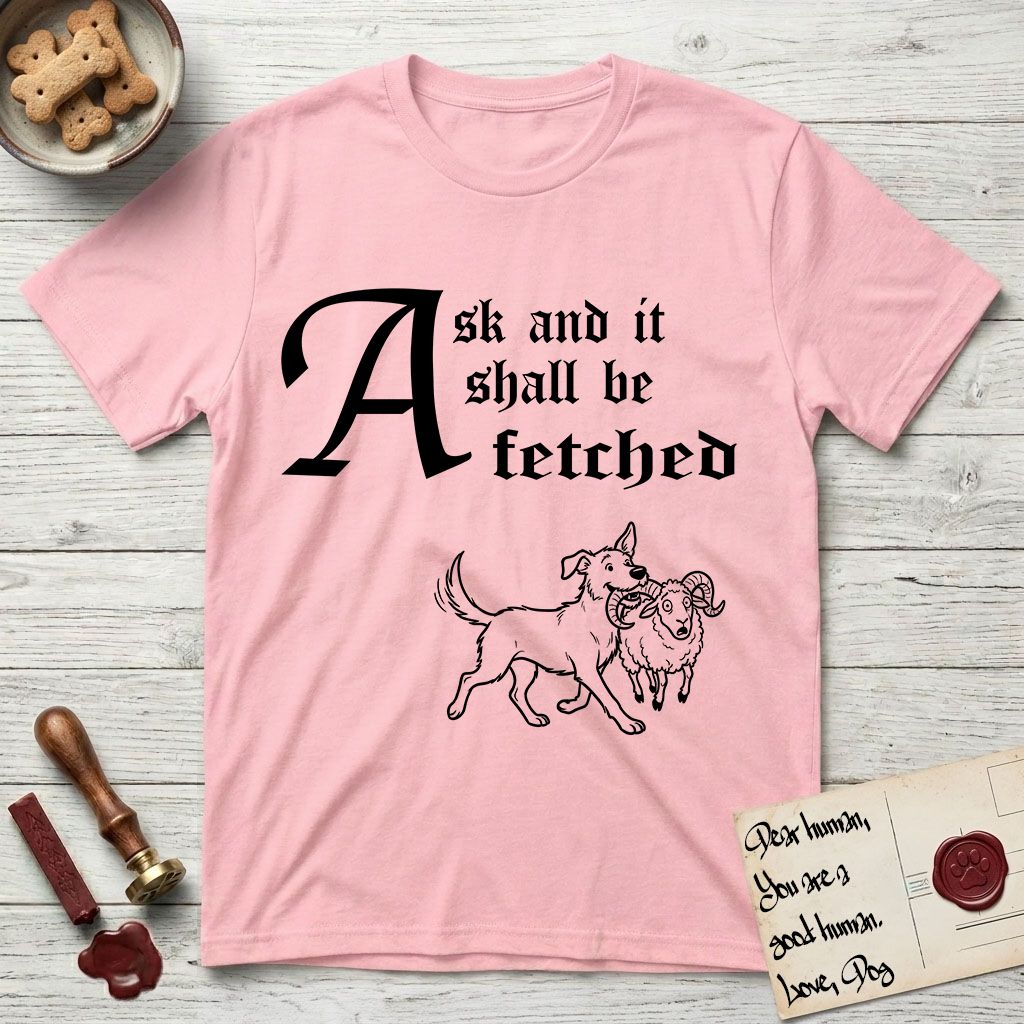 Ask and It Shall Be Fetched Rescue Mutt T-Shirt flat lay in Light Pink, featuring a sparse pen-and-ink illustration of a rescue mutt at a proud trot carrying a very surprised ram.