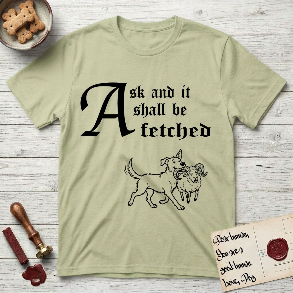 Ask and It Shall Be Fetched Rescue Mutt T-Shirt flat lay in Pistachio, featuring a sparse pen-and-ink illustration of a rescue mutt at a proud trot carrying a very surprised ram.