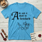 Ask and It Shall Be Fetched Rescue Mutt T-Shirt flat lay in Sky, featuring a sparse pen-and-ink illustration of a rescue mutt at a proud trot carrying a very surprised ram.