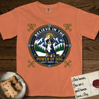 Believe in the Power of Dog Bernese Mountain Dog T-Shirt flat lay in Melon, featuring a circular national-park-style badge with a haloed Bernese Mountain Dog, a mountain scene, a rope border, and the words Loyalty, Warmth, Love.