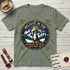 Believe in the Power of Dog Bernese Mountain Dog T-Shirt flat lay in Sage, featuring a circular national-park-style badge with a haloed Bernese Mountain Dog, a mountain scene, a rope border, and the words Loyalty, Warmth, Love.