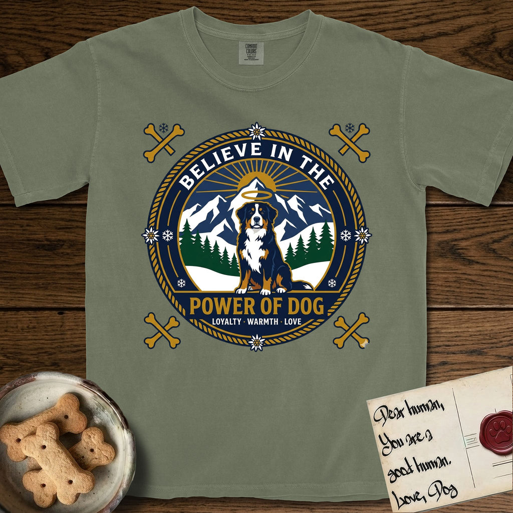 Believe in the Power of Dog Bernese Mountain Dog T-Shirt flat lay in Sage, featuring a circular national-park-style badge with a haloed Bernese Mountain Dog, a mountain scene, a rope border, and the words Loyalty, Warmth, Love.