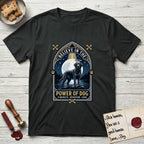 Believe in the Power of Dog Black Lab T-Shirt flat lay in Black, featuring a dramatic gothic-arch badge with a moonlit Black Lab on a rock above still water, a beam of light through the arch, and the words Strength, Devotion, Love.