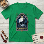 Believe in the Power of Dog Black Lab T-Shirt flat lay in Irish Green, featuring a dramatic gothic-arch badge with a moonlit Black Lab on a rock above still water, a beam of light through the arch, and the words Strength, Devotion, Love.
