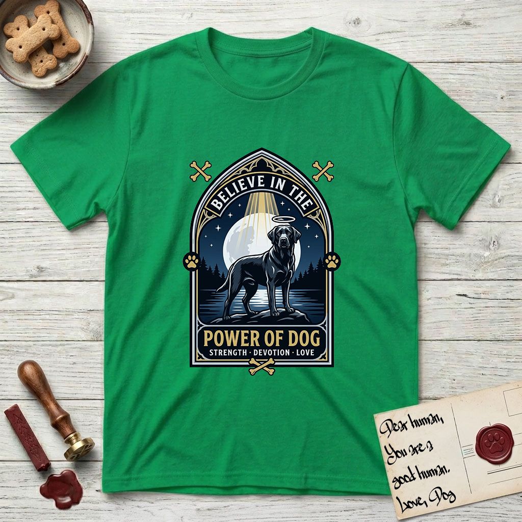Believe in the Power of Dog Black Lab T-Shirt flat lay in Irish Green, featuring a dramatic gothic-arch badge with a moonlit Black Lab on a rock above still water, a beam of light through the arch, and the words Strength, Devotion, Love.