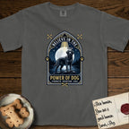 Believe in the Power of Dog Black Lab T-Shirt flat lay in Pepper, featuring a dramatic gothic-arch badge with a moonlit Black Lab on a rock above still water, a beam of light through the arch, and the words Strength, Devotion, Love.
