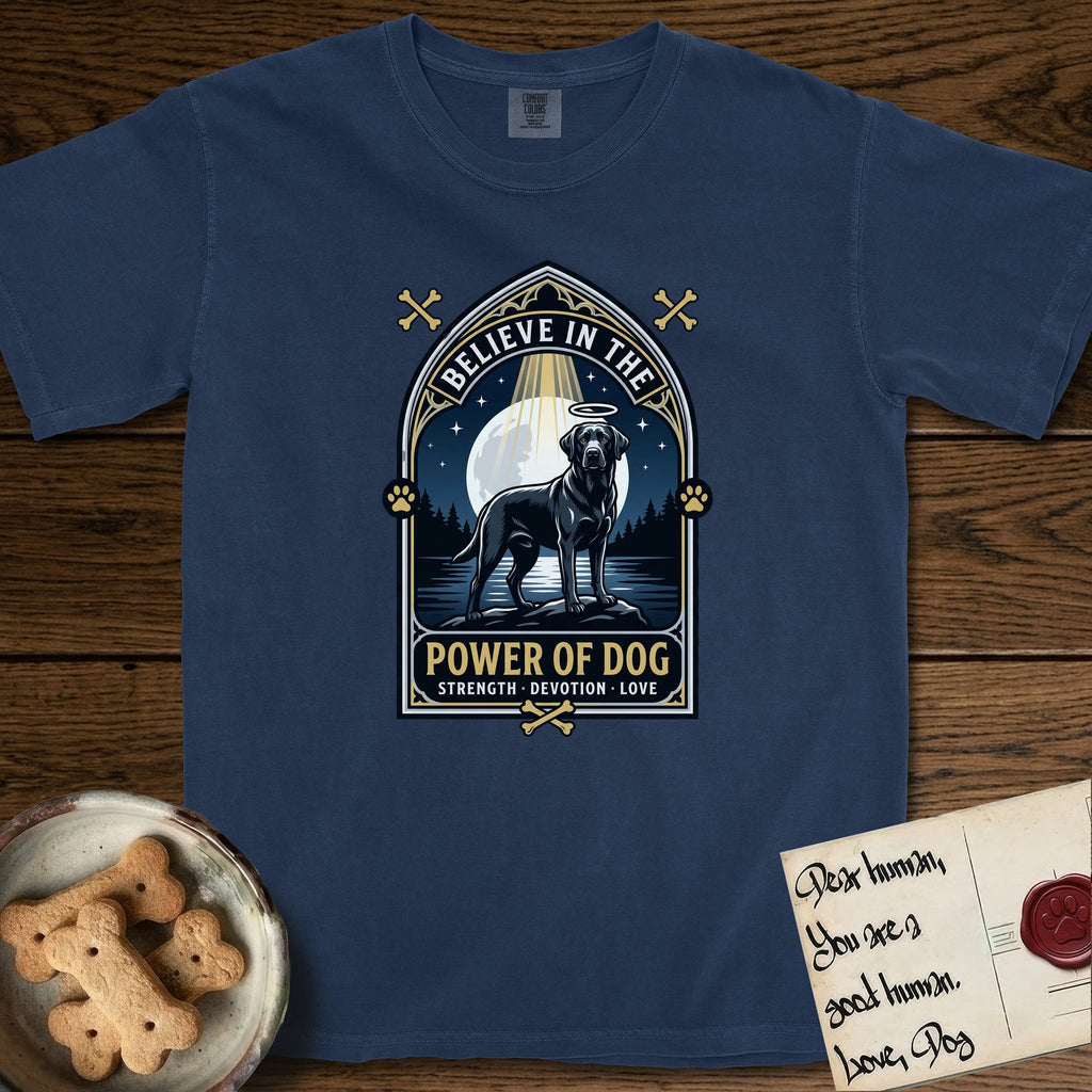 Believe in the Power of Dog Black Lab T-Shirt flat lay in True Navy, featuring a dramatic gothic-arch badge with a moonlit Black Lab on a rock above still water, a beam of light through the arch, and the words Strength, Devotion, Love.