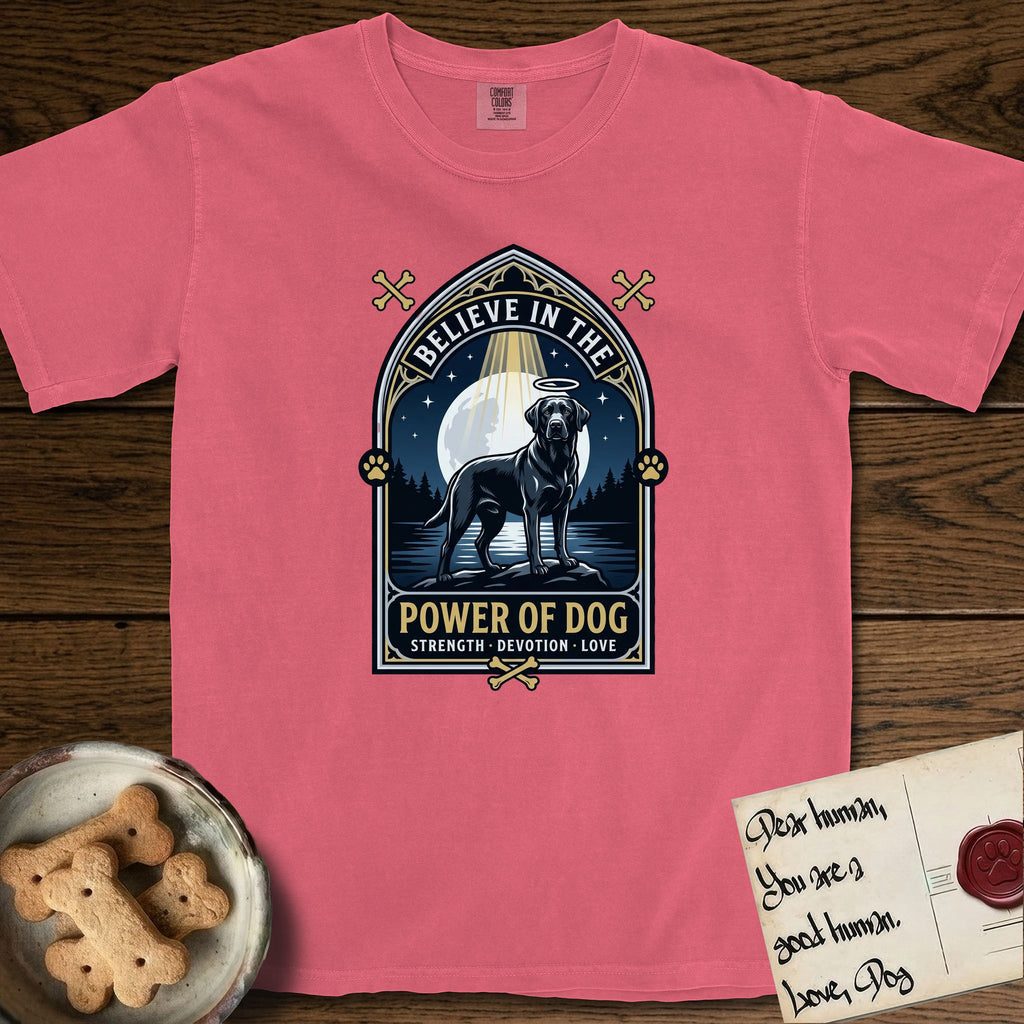 Believe in the Power of Dog Black Lab T-Shirt flat lay in Watermelon, featuring a dramatic gothic-arch badge with a moonlit Black Lab on a rock above still water, a beam of light through the arch, and the words Strength, Devotion, Love.