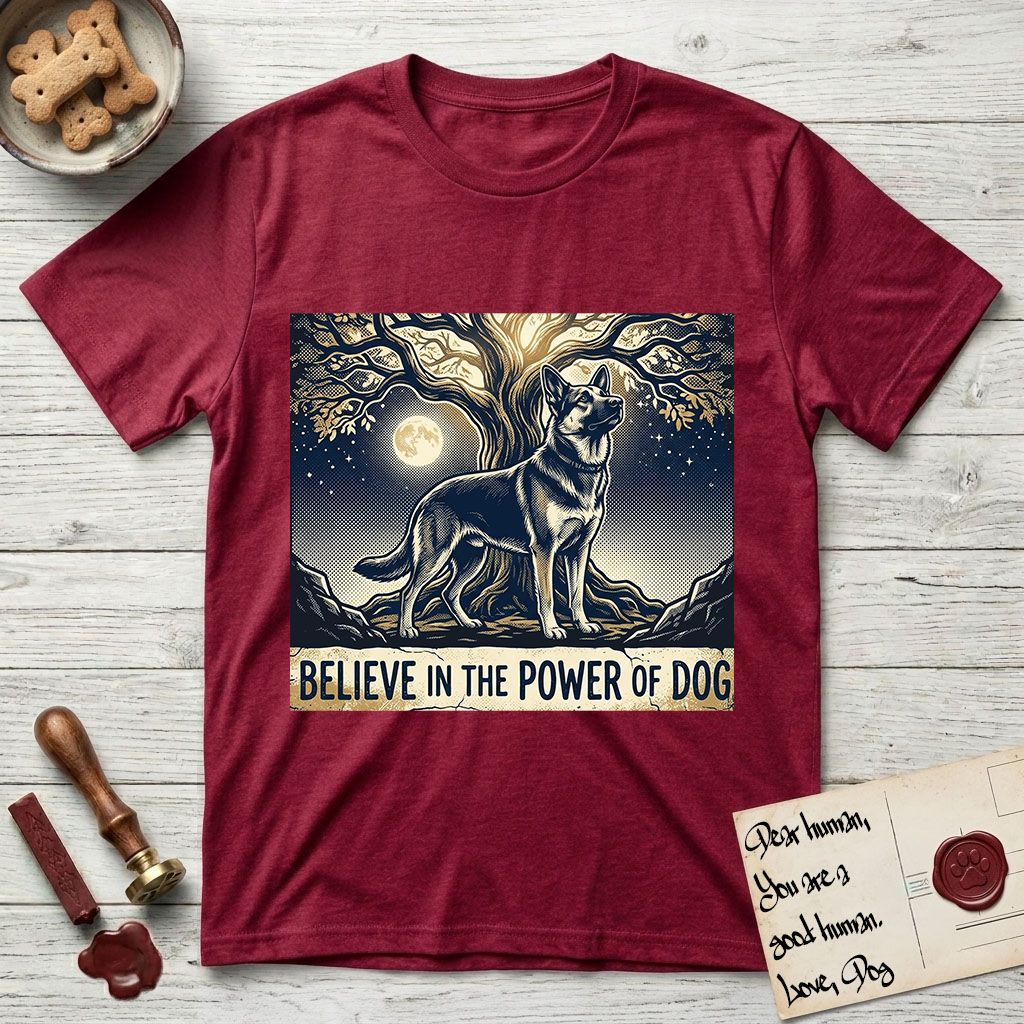 Believe in the Power of Dog German Shepherd T-Shirt flat lay in Antique Cherry Red, featuring a moonlit illustration of a German Shepherd standing beneath a great tree whose roots and branches reach equally in both directions.