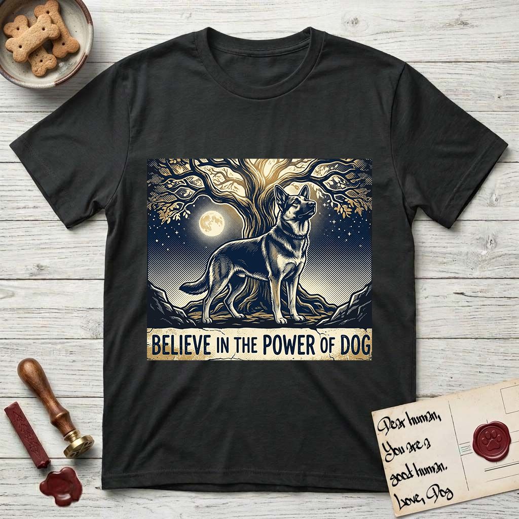 Believe in the Power of Dog German Shepherd T-Shirt flat lay in Black, featuring a moonlit illustration of a German Shepherd standing beneath a great tree whose roots and branches reach equally in both directions.