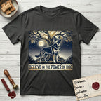 Believe in the Power of Dog German Shepherd T-Shirt flat lay in Charcoal, featuring a moonlit illustration of a German Shepherd standing beneath a great tree whose roots and branches reach equally in both directions.