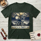 Believe in the Power of Dog German Shepherd T-Shirt flat lay in Forest Green, featuring a moonlit illustration of a German Shepherd standing beneath a great tree whose roots and branches reach equally in both directions.