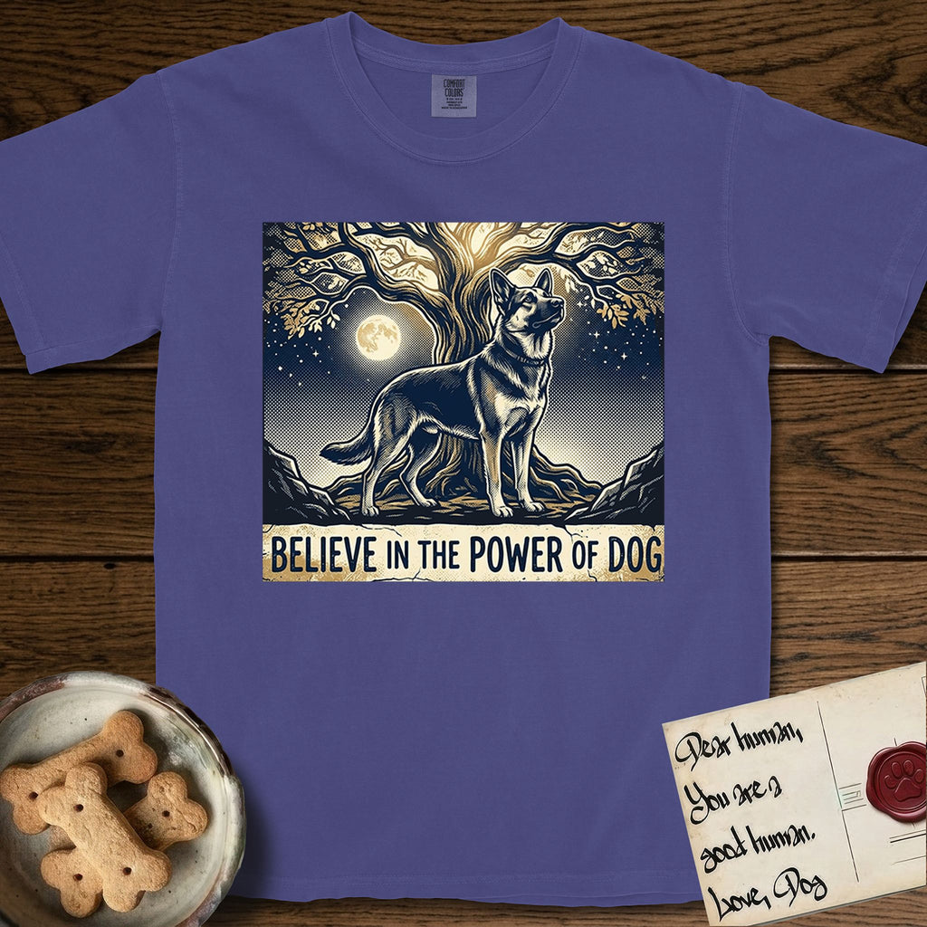 Believe in the Power of Dog German Shepherd T-Shirt flat lay in Grape, featuring a moonlit illustration of a German Shepherd standing beneath a great tree whose roots and branches reach equally in both directions.