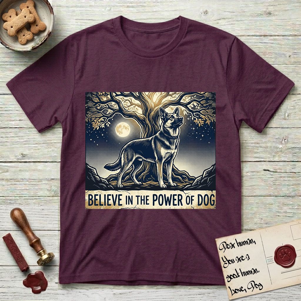 Believe in the Power of Dog German Shepherd T-Shirt flat lay in Maroon, featuring a moonlit illustration of a German Shepherd standing beneath a great tree whose roots and branches reach equally in both directions.