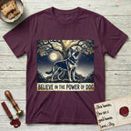Believe in the Power of Dog German Shepherd T-Shirt flat lay in Maroon, featuring a moonlit illustration of a German Shepherd standing beneath a great tree whose roots and branches reach equally in both directions.