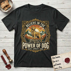 Believe in the Power of Dog Golden Retriever T-Shirt flat lay in Black, featuring a vintage outdoor badge with a haloed Golden Retriever standing on a rock above the treeline at sunrise and the words Faith, Loyalty, Love.