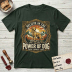 Believe in the Power of Dog Golden Retriever T-Shirt flat lay in Forest Green, featuring a vintage outdoor badge with a haloed Golden Retriever standing on a rock above the treeline at sunrise and the words Faith, Loyalty, Love.