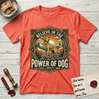 Believe in the Power of Dog Golden Retriever T-Shirt flat lay in Heather Orange, featuring a vintage outdoor badge with a haloed Golden Retriever standing on a rock above the treeline at sunrise and the words Faith, Loyalty, Love.