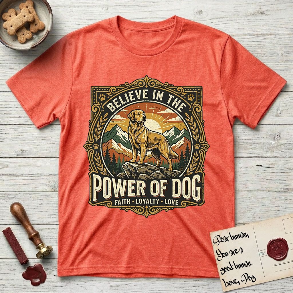 Believe in the Power of Dog Golden Retriever T-Shirt flat lay in Heather Orange, featuring a vintage outdoor badge with a haloed Golden Retriever standing on a rock above the treeline at sunrise and the words Faith, Loyalty, Love.