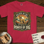 Believe in the Power of Dog Golden Retriever T-Shirt flat lay in Red, featuring a vintage outdoor badge with a haloed Golden Retriever standing on a rock above the treeline at sunrise and the words Faith, Loyalty, Love.