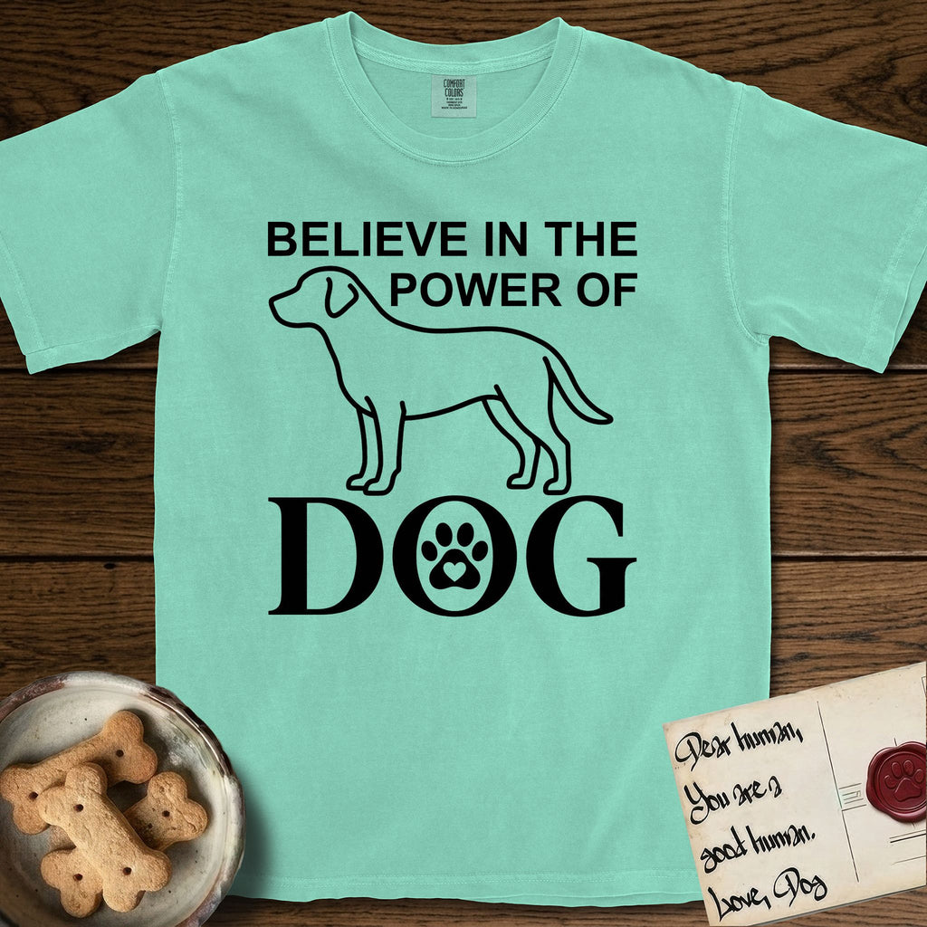 Believe in the Power of Dog Labrador T-Shirt flat lay in Island Reef, featuring stark minimalist single-line art of a Labrador with bold stacked "Believe in the Power of Dog" type and a paw-print heart in the O.