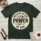 Believe in the Power of Dog Paw T-Shirt flat lay in Forest Green, featuring a vintage engraving medallion of a Dog paw and a human hand meeting over crossed bones in a sunburst.
