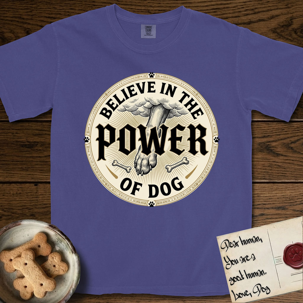 Believe in the Power of Dog Paw T-Shirt flat lay in Grape, featuring a vintage engraving medallion of a Dog paw and a human hand meeting over crossed bones in a sunburst.