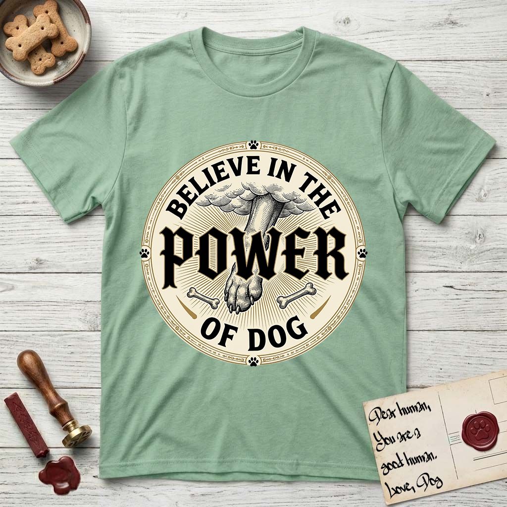Believe in the Power of Dog Paw T-Shirt flat lay in Mint Green, featuring a vintage engraving medallion of a Dog paw and a human hand meeting over crossed bones in a sunburst.