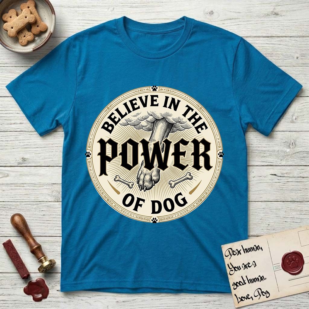 Believe in the Power of Dog Paw T-Shirt flat lay in Sapphire, featuring a vintage engraving medallion of a Dog paw and a human hand meeting over crossed bones in a sunburst.
