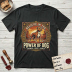 Believe in the Power of Dog Pitbull Cityscape T-Shirt flat lay in Black, featuring a vintage urban badge with a brick-red Pitbull, a city skyline, a radiating sun, and the words Strength, Heart, Loyalty.