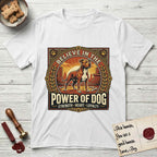 Believe in the Power of Dog Pitbull Cityscape T-Shirt flat lay in White, featuring a vintage urban badge with a brick-red Pitbull, a city skyline, a radiating sun, and the words Strength, Heart, Loyalty.