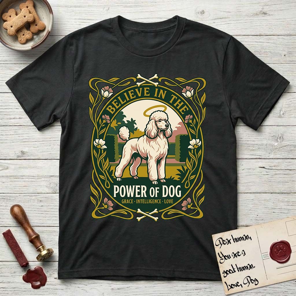 Believe in the Power of Dog Poodle T-Shirt flat lay in Black, featuring an Art Nouveau floral badge with a haloed Poodle in a garden park scene and the words Grace, Intelligence, Love.