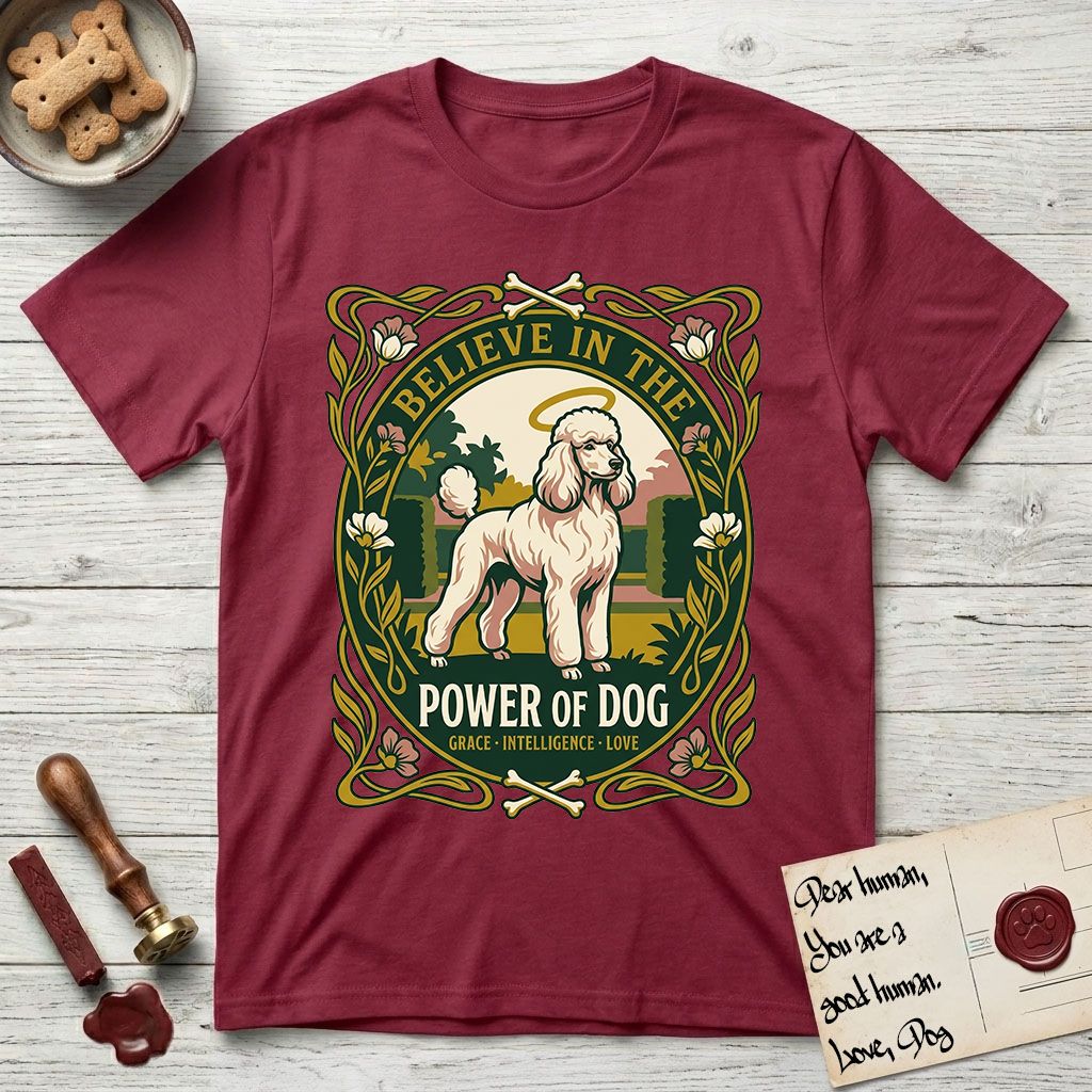 Believe in the Power of Dog Poodle T-Shirt flat lay in Cardinal Red, featuring an Art Nouveau floral badge with a haloed Poodle in a garden park scene and the words Grace, Intelligence, Love.