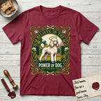 Believe in the Power of Dog Poodle T-Shirt flat lay in Cardinal Red, featuring an Art Nouveau floral badge with a haloed Poodle in a garden park scene and the words Grace, Intelligence, Love.