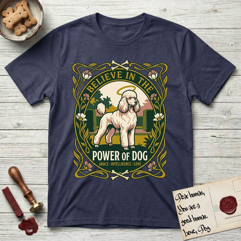 Believe in the Power of Dog Poodle T-Shirt flat lay in Navy, featuring an Art Nouveau floral badge with a haloed Poodle in a garden park scene and the words Grace, Intelligence, Love.