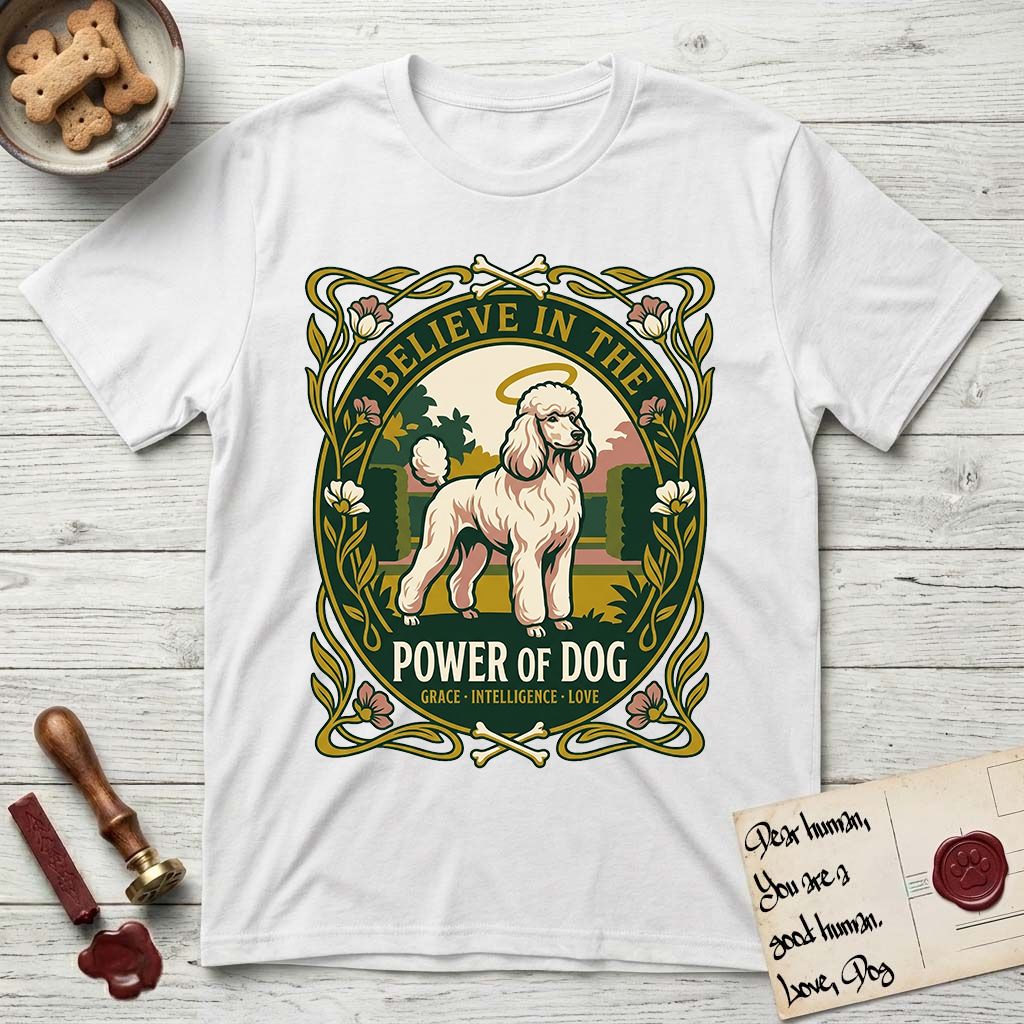 Believe in the Power of Dog Poodle T-Shirt flat lay in White, featuring an Art Nouveau floral badge with a haloed Poodle in a garden park scene and the words Grace, Intelligence, Love.