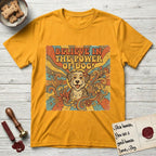 Believe in the Power of Dog Rescue Mutt T-Shirt flat lay in Gold, featuring a retro 1970s groovy poster of a grinning rescue mutt with a radiating sunburst and swirling florals.